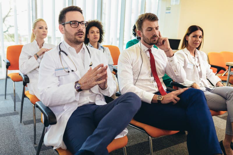 Young doctors on seminar in lecture hall at hospital royalty free stock images Young doctors on seminar in lecture hall at hospital royalty free stock images