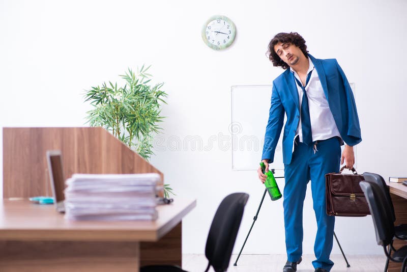 Young drunk employee in the office royalty free stock photos Young drunk employee in the office royalty free stock photos
