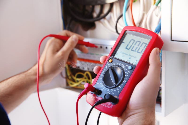 Young electrician measuring voltage royalty free stock photos Young electrician measuring voltage royalty free stock photos