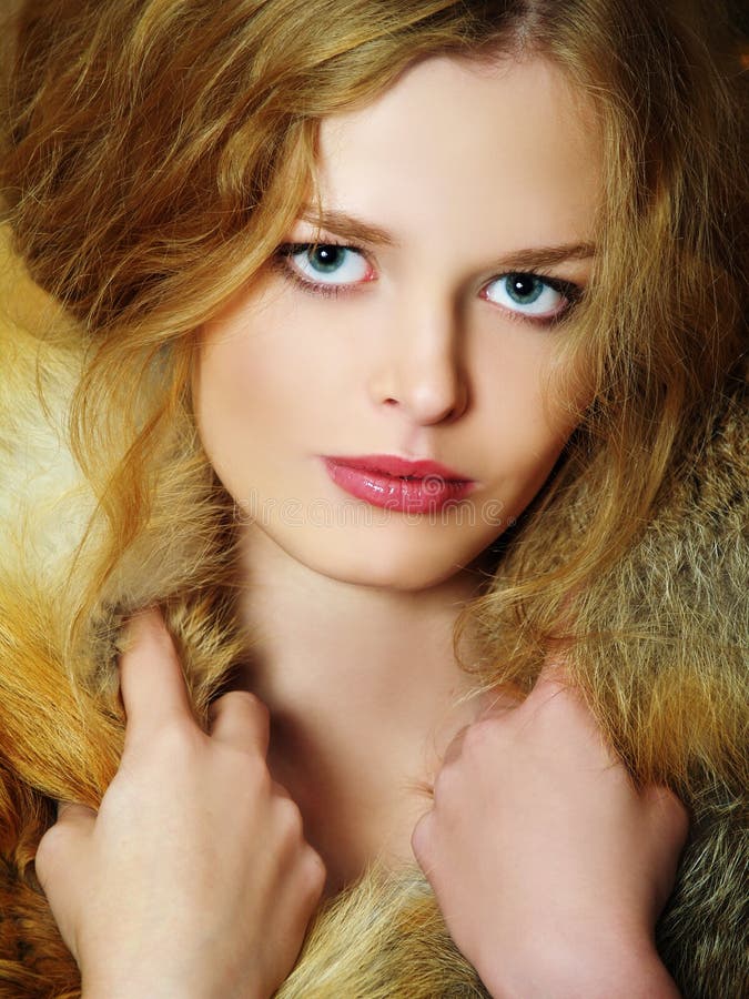 Young elegant girl with fur collar