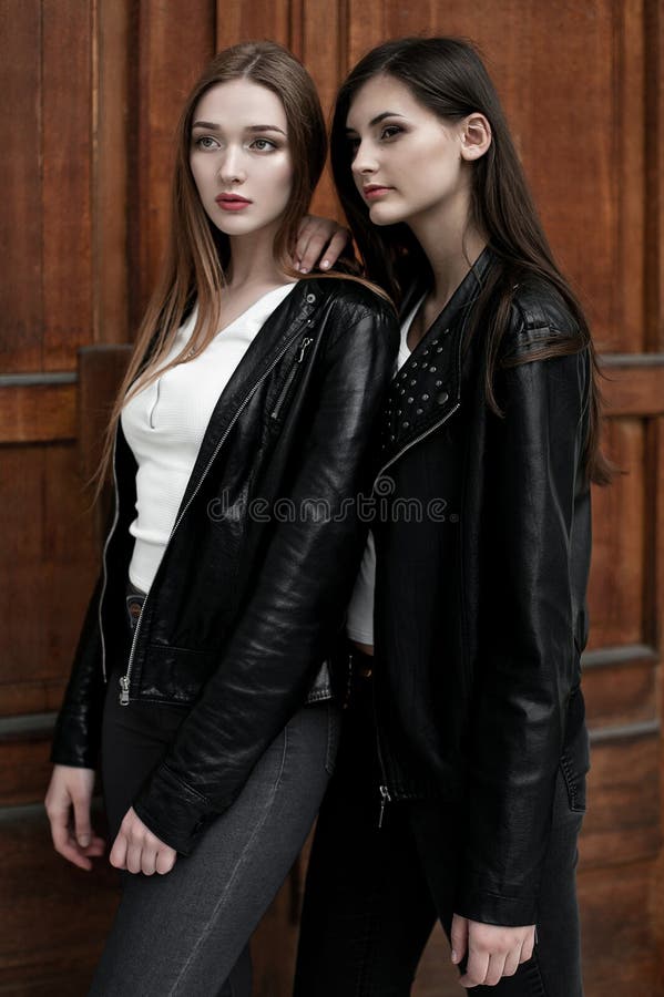 Young elegant trendy girls outdoors, wearing black and white clothing royalty free stock image Young elegant trendy girls outdoors, wearing black and white clothing royalty free stock image