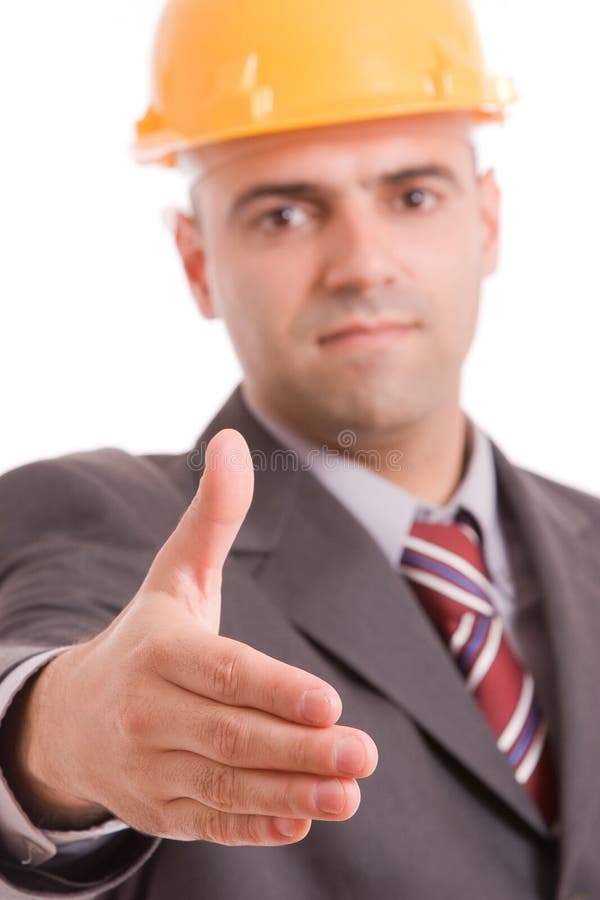 Young engineer offering handshake stock image