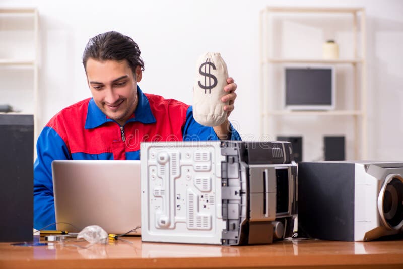 Young engineer repairing musical hi-fi system royalty free stock images