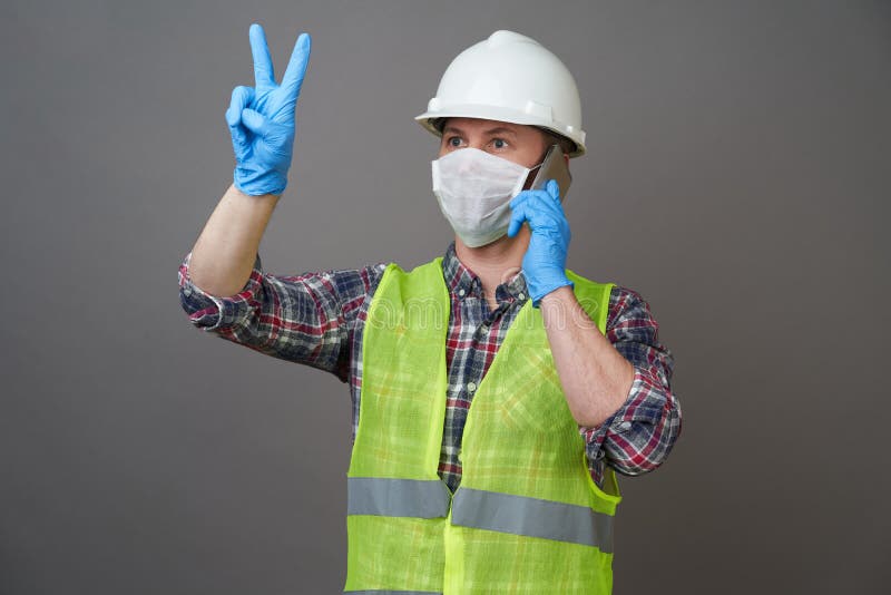Young Engineer Worker Wear a White Helmet and Medical Mask Stock Image ...