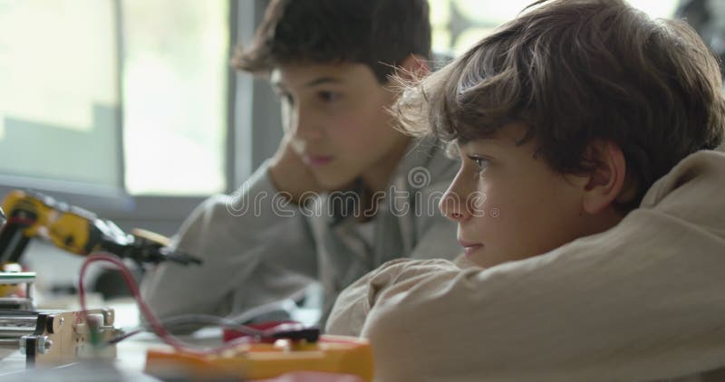 Students using a 3D printer in the lab stock video footage