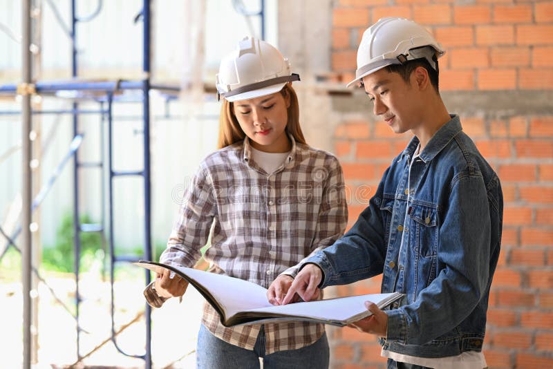 Young Engineers Supervising Progress of Construction Project Together. Industry, Engineer