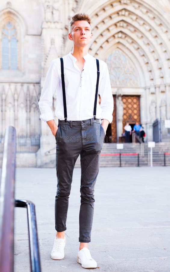 Young European Guy in Shirt and Trousers with Suspenders Walking Around ...