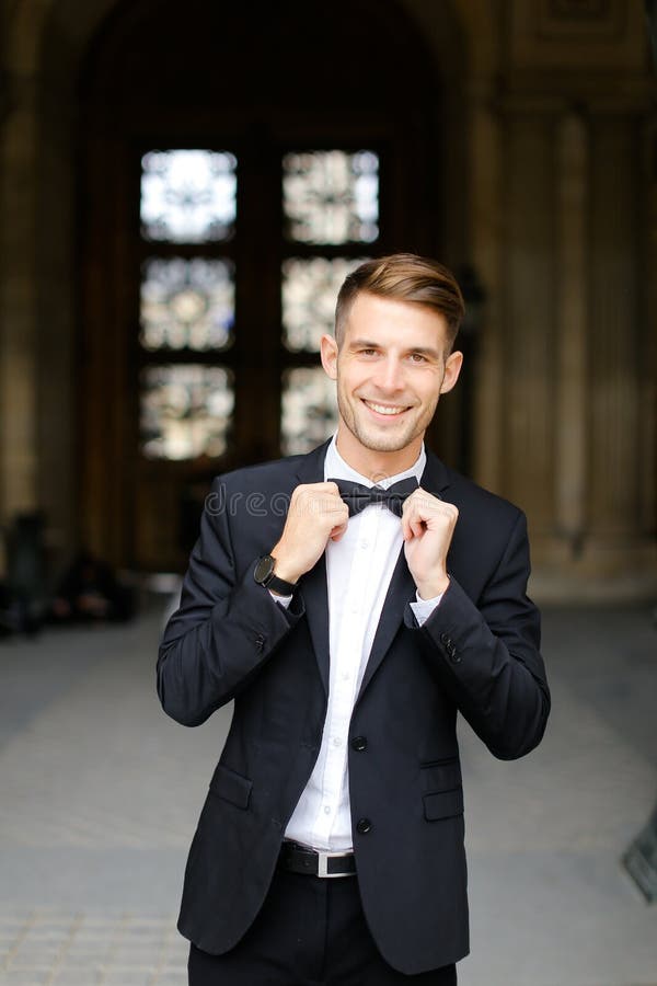 all black suit and bow tie