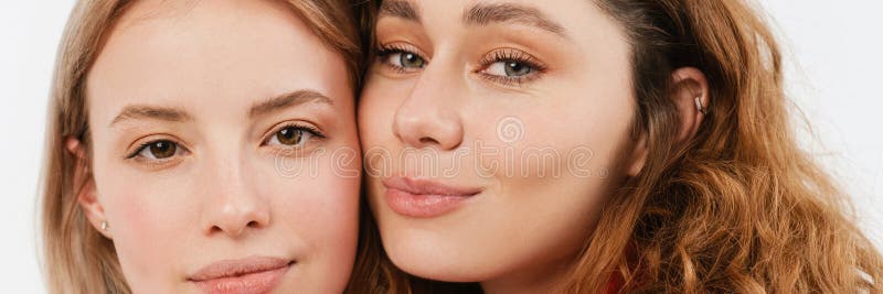 Young european two women posing and looking at camera royalty free stock images