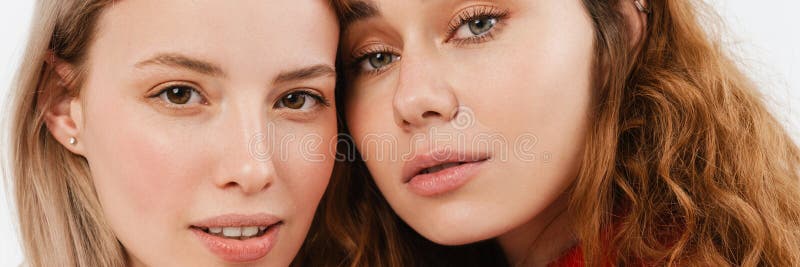 Young european two women posing and looking at camera royalty free stock photography