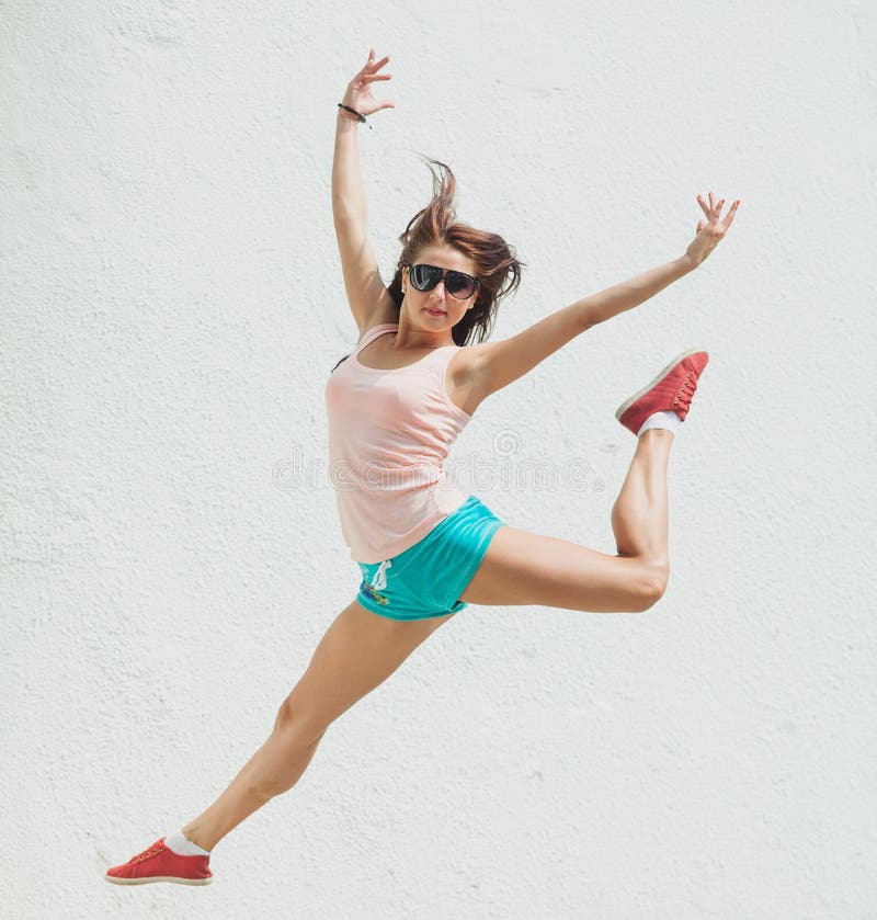 Young excited girl jumping stock photo. Image of expression 32868494