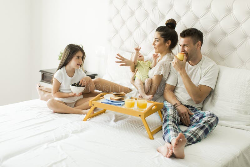 Young familly on the bed