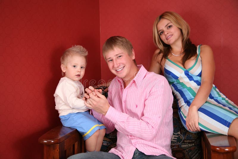 Young family in armchair