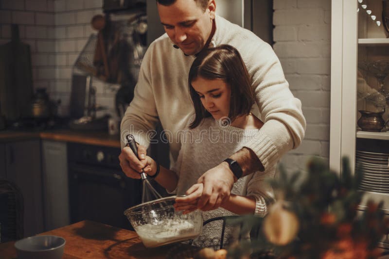 Young Family, Father and Daughter Cooking Homemade Cake Together