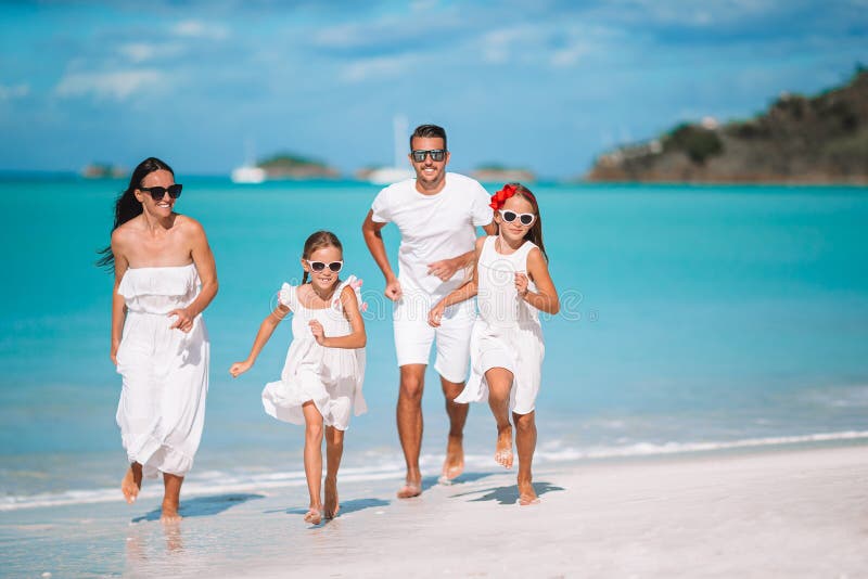 Young family of four on vacation have fun royalty free stock image Young family of four on vacation have fun royalty free stock image