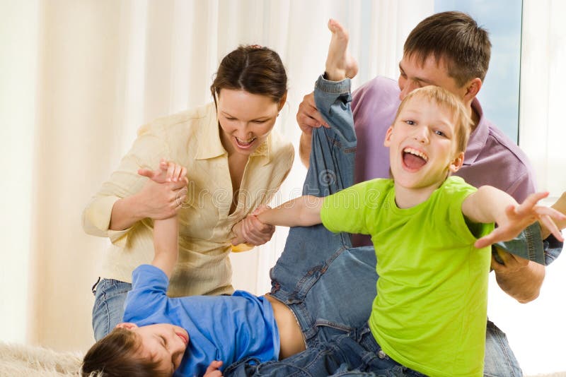 Young family fun playing