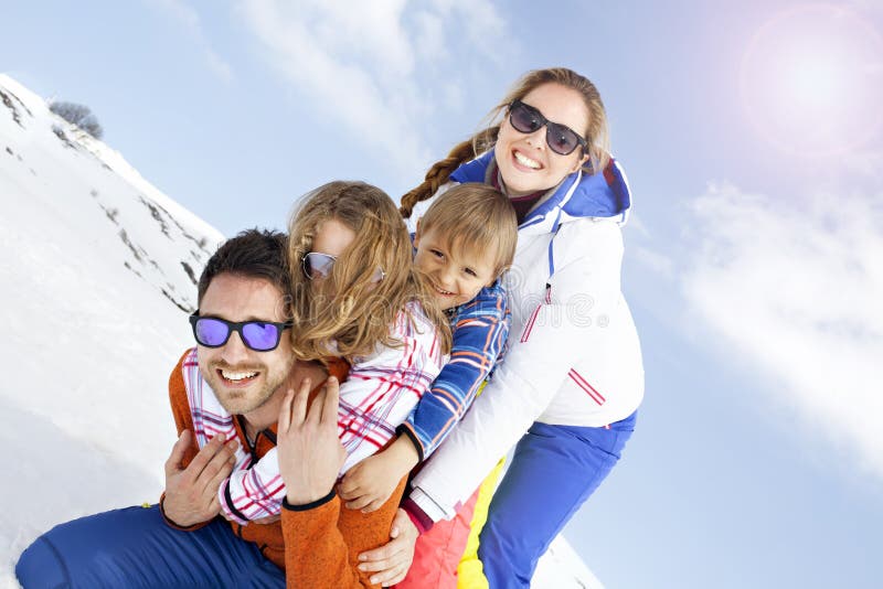 Young family having fun in the snow