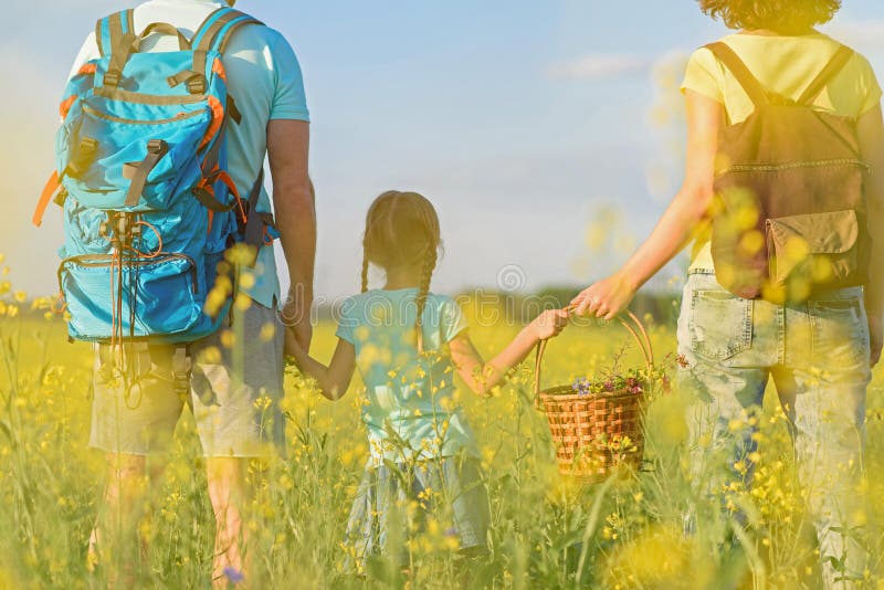 Young family hiking on mountain stock photo Young family hiking on mountain stock photo