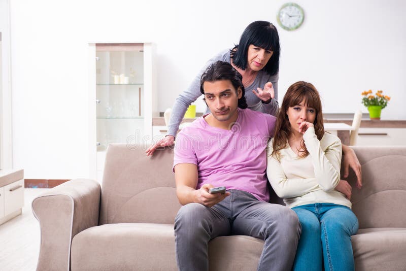 Young Family and Motherinlaw in Family Issues Concept Stock Image