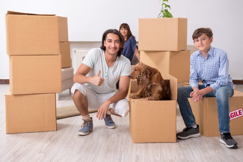 Young family moving to new flat royalty free stock photo