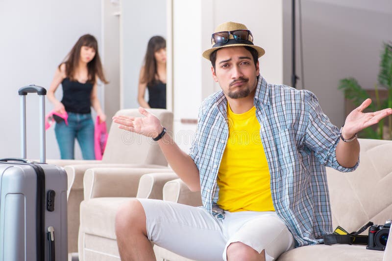 The young family packing for vacation travel royalty free stock photography