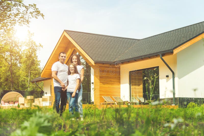 Young family with son and daughter move to a new country house. moving day.