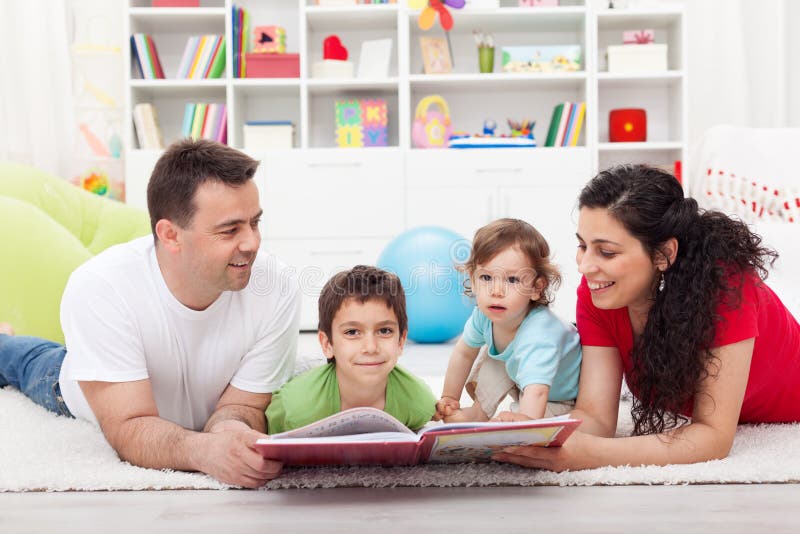 Young family story time with the kids royalty free stock photo
