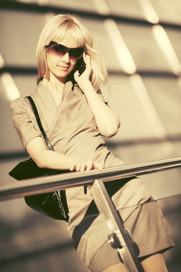 Young Fashion Business Woman In Sunglasses Talking On Cell Phone Stock