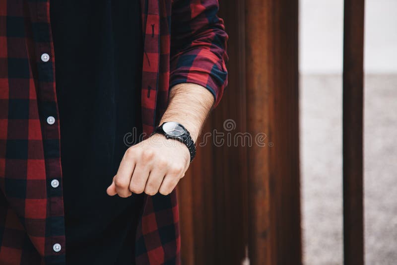 Young Fashionable Man Wearing a Red Checked Shirt and a Black Analog Wrist  Watch. Street Style Detail of Stock Image - Image of elegant, male:  120574839