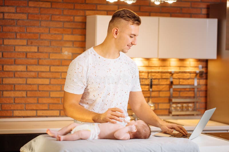 Father is Changing Nappy To His Baby Boy Stock Photo Image of embrace