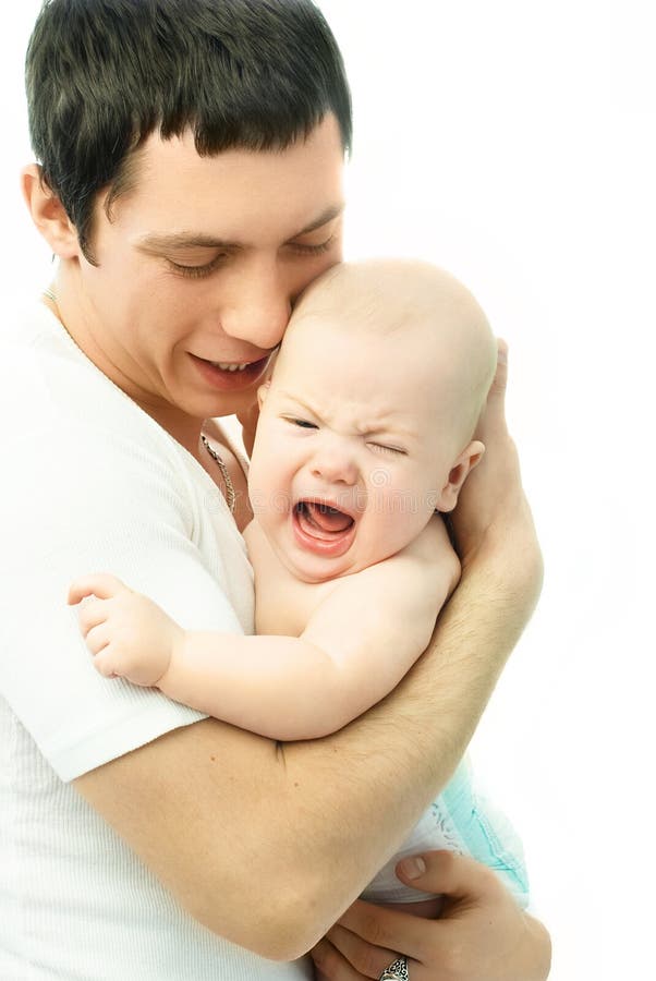 Young father with a crying baby