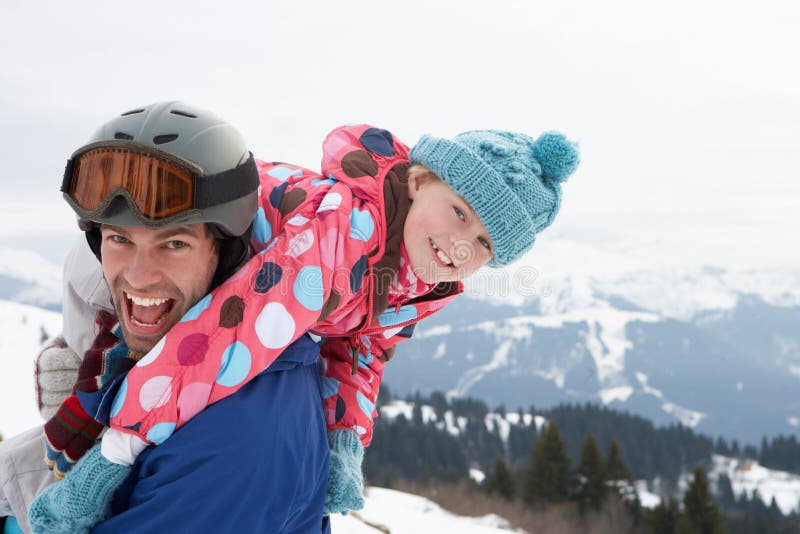 Young Father And Daughter On Winter Vacation