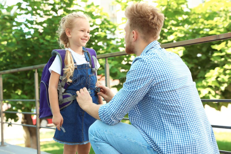 Young father and his little child on their way to school royalty free stock photos Young father and his little child on their way to school royalty free stock photos