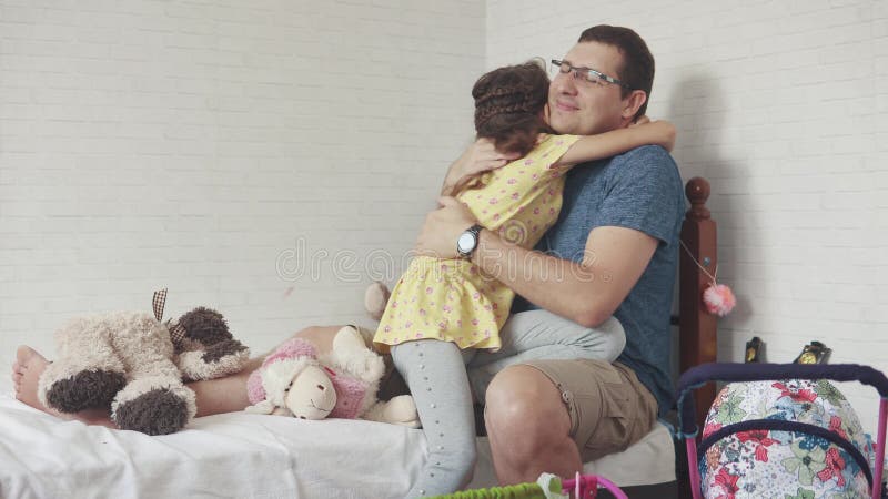 The Young Father and Daughter Play Together in the Children`s Room. the Girl Hugs Her Father Stock Footage - Video of adult, little: 119512898