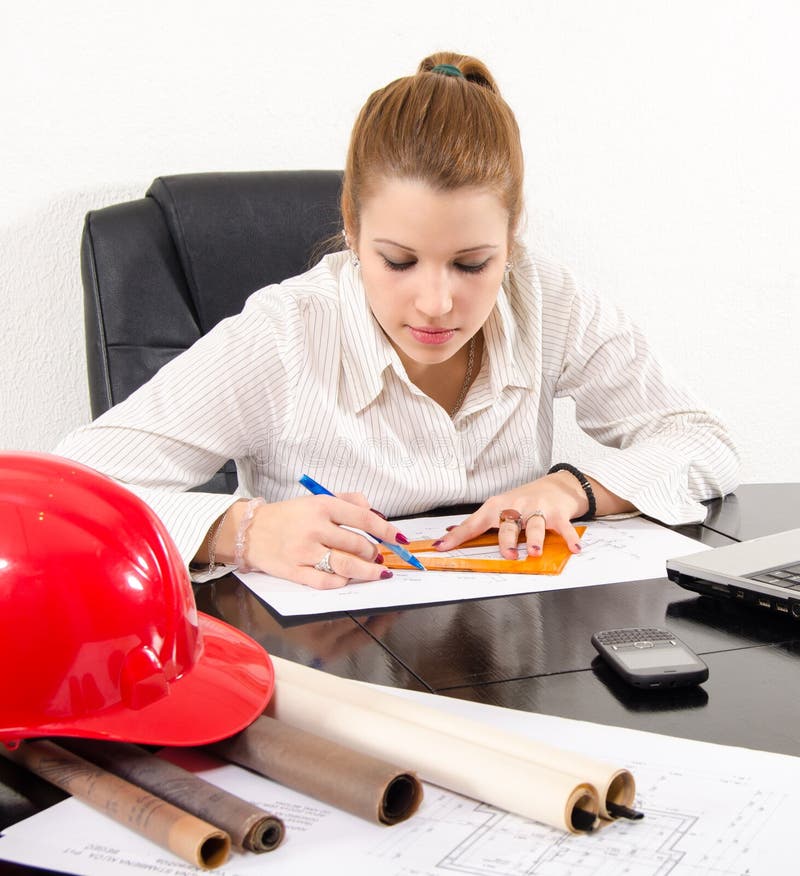 Young female architect working on the project