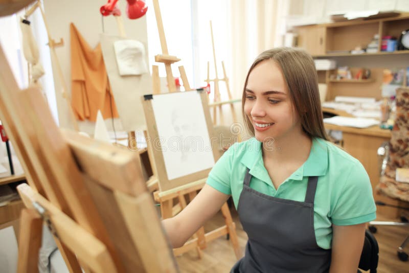 Young Female Art Student Painting in Stock Photo Image of
