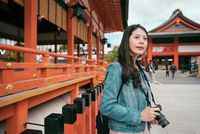 Young female asian photographer shooting royalty free stock image