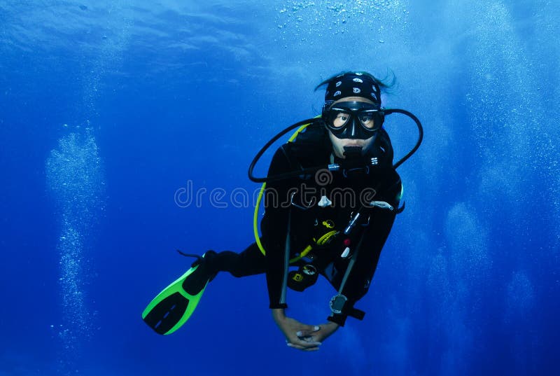 Young female Asian scuba diver