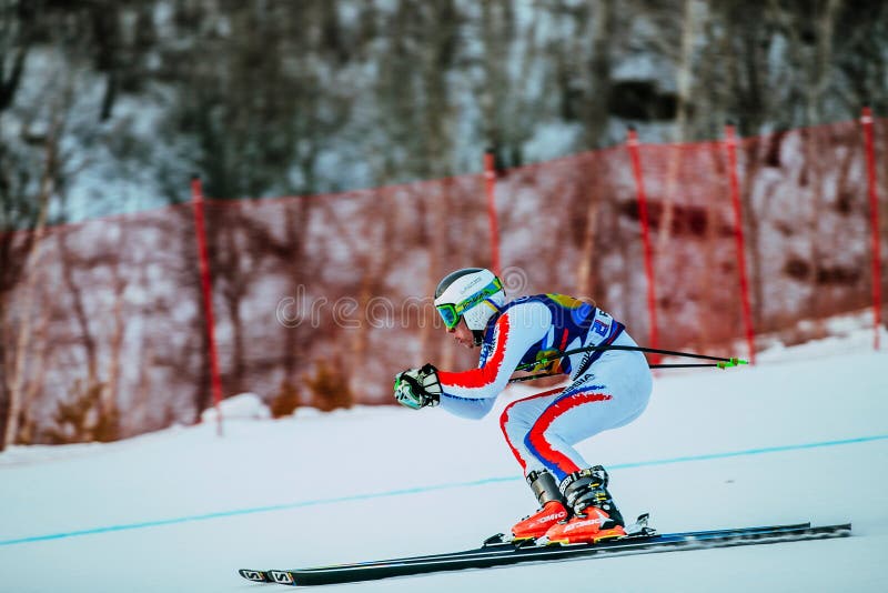Young female athlete in downhill during Russian Cup in alpine skiing stock image Young female athlete in downhill during Russian Cup in alpine skiing stock image
