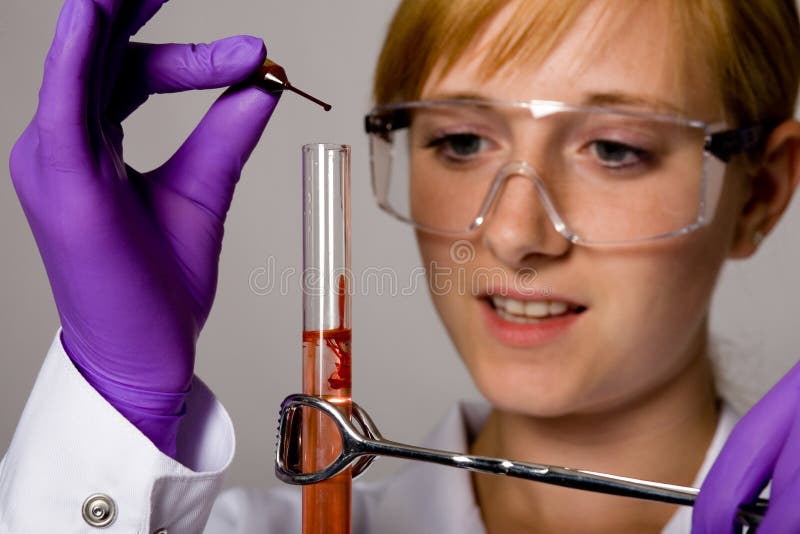 Young female chemist doing some research, tests