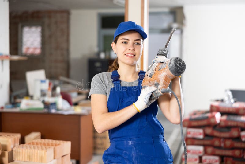 Female Worker Posing on Indoor Construction Site Stock Photo - Image of ...