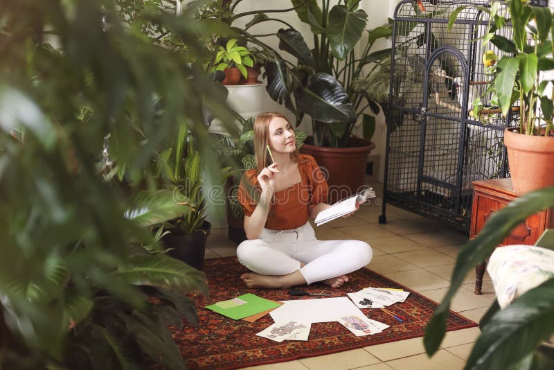 Young female creating her Feng Shui wish map. Dreams and wishes