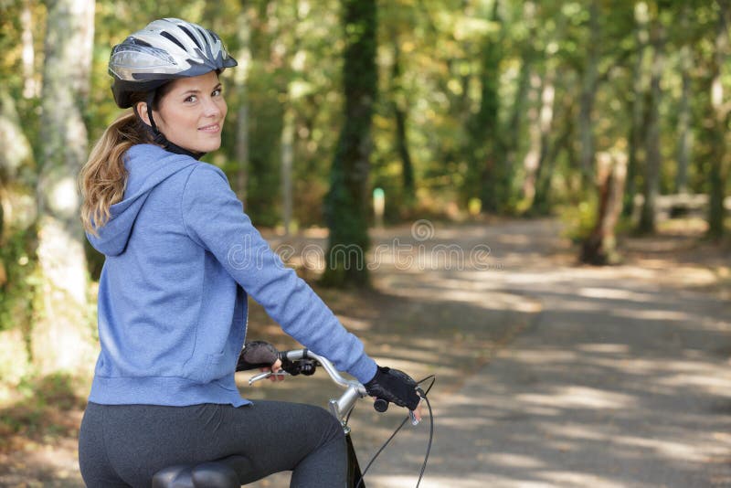 Young Female Cyclist in Forest Stock Photo Image of bicycle, meadow