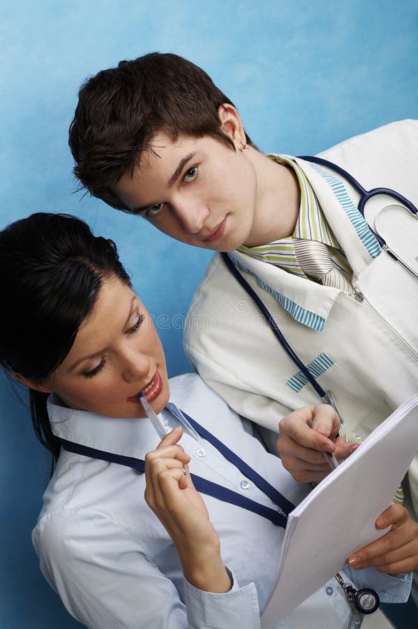 Young female doctor with assistant