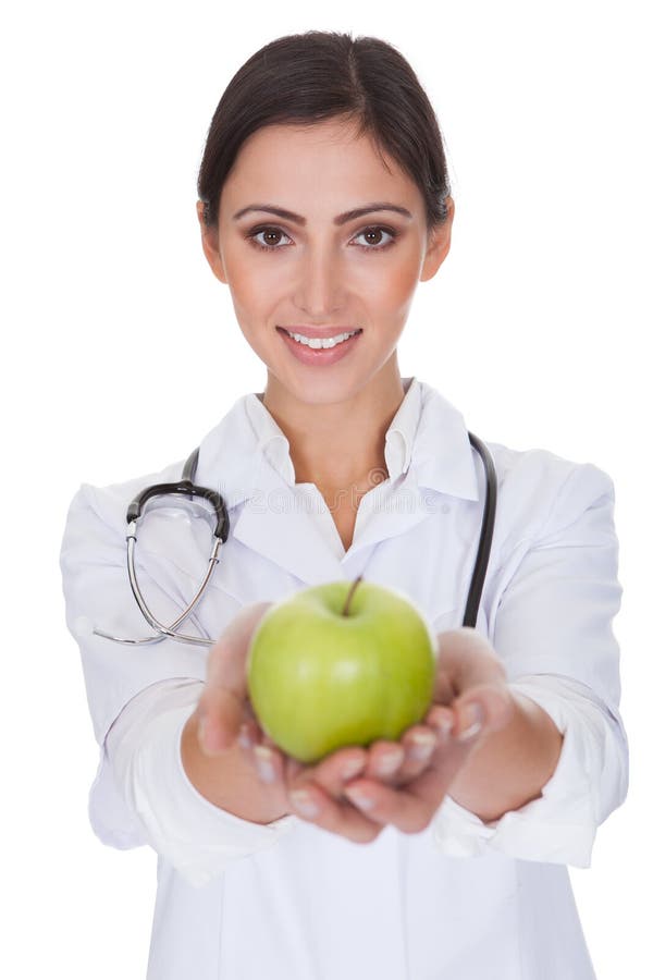 Young Female Doctor Holding Green Apple