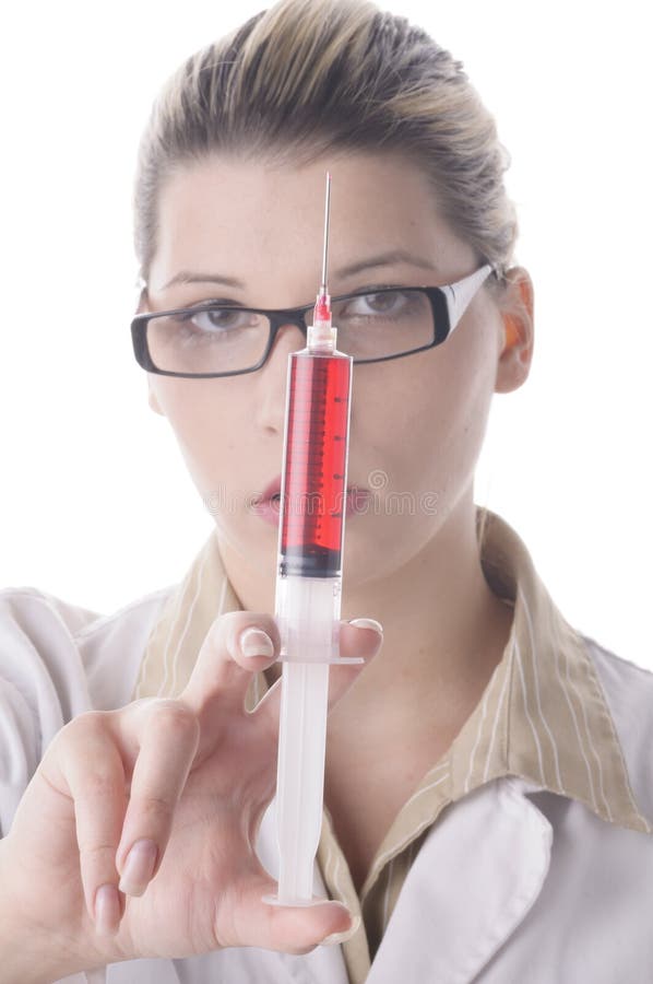 Young female doctor holding a syringe