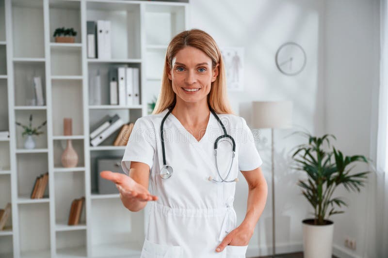 Young Female Doctor in White Coat is Indoors Stock Photo Image of