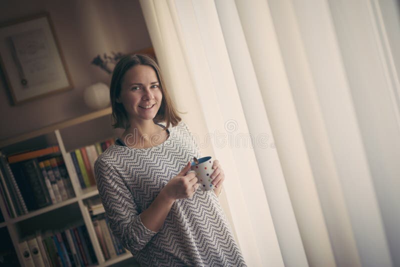 Young female enterpreneur drinking coffee royalty free stock images Young female enterpreneur drinking coffee royalty free stock images