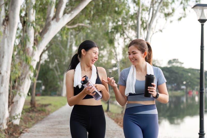 Young Female Friends Exercising Together in the Park, Enjoying Fitness and Healthy Lifestyle Outdoors stock image