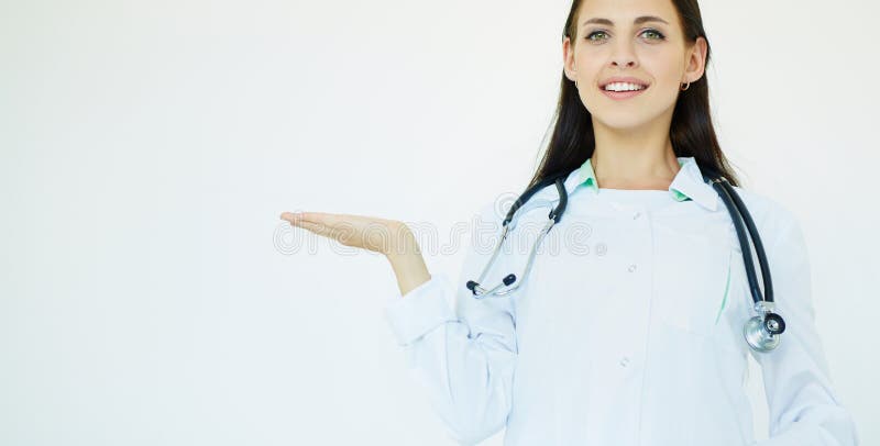 Young female medical doctor presenting and showing copy space for product or text over the palm. Caucasian female royalty free stock images Young female medical doctor presenting and showing copy space for product or text over the palm. Caucasian female royalty free stock images